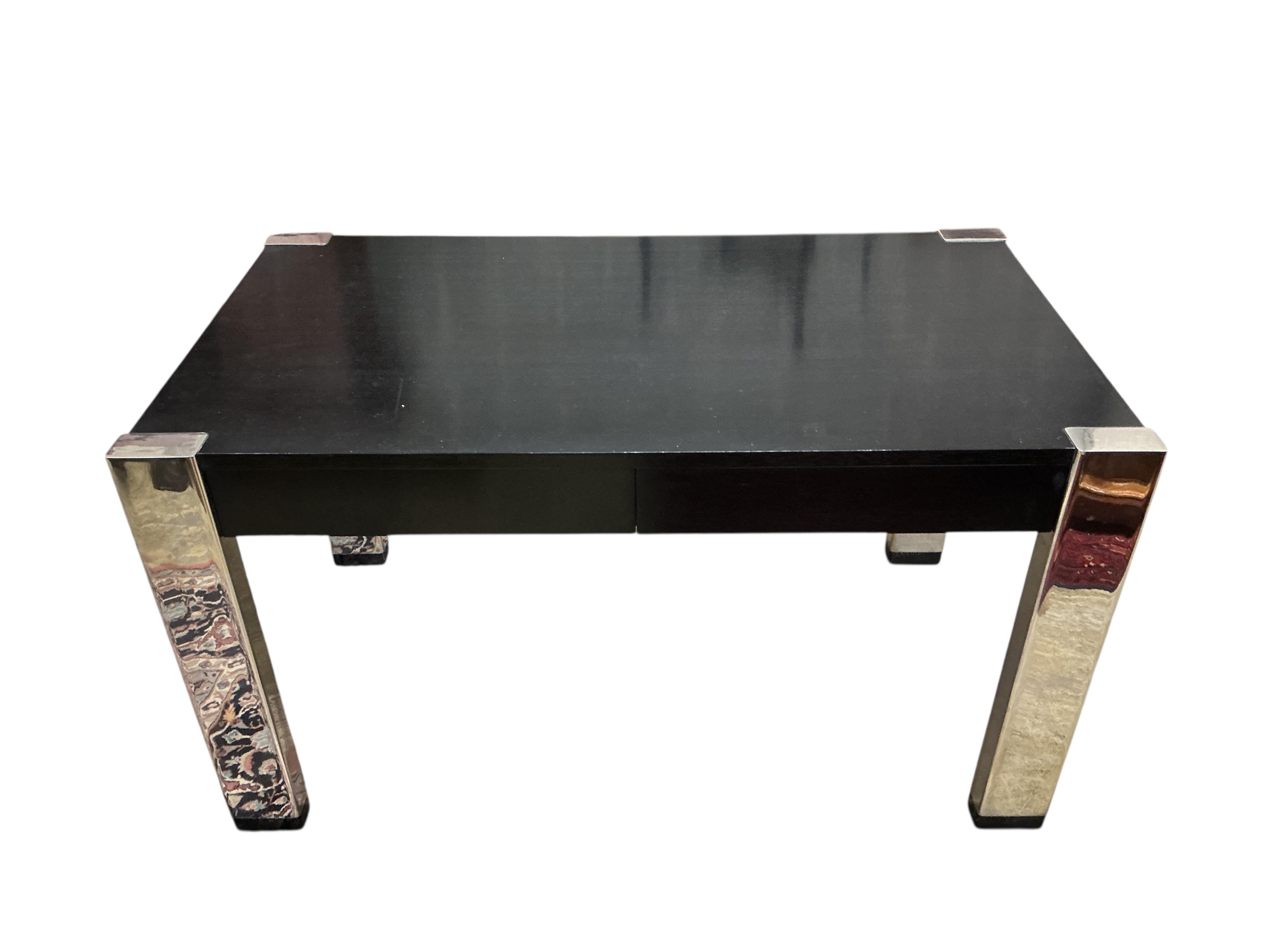 A Contemporary ebonised and chrome desk, retailed by Harrods, width 139cm, depth 78cm, height 78cm